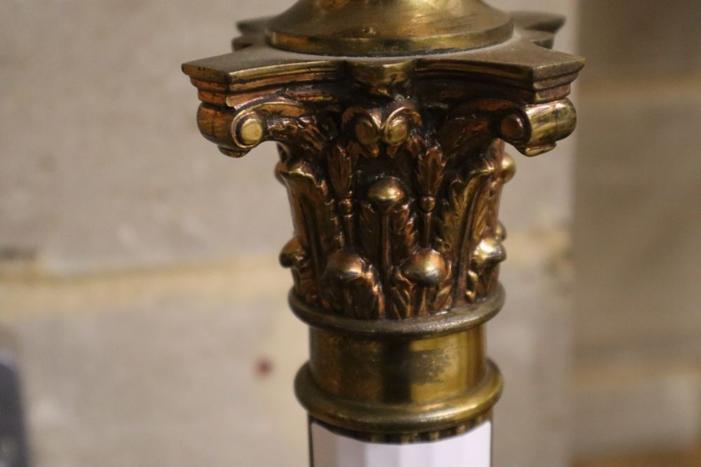 A brass Corinthian column adjustable standard lamp